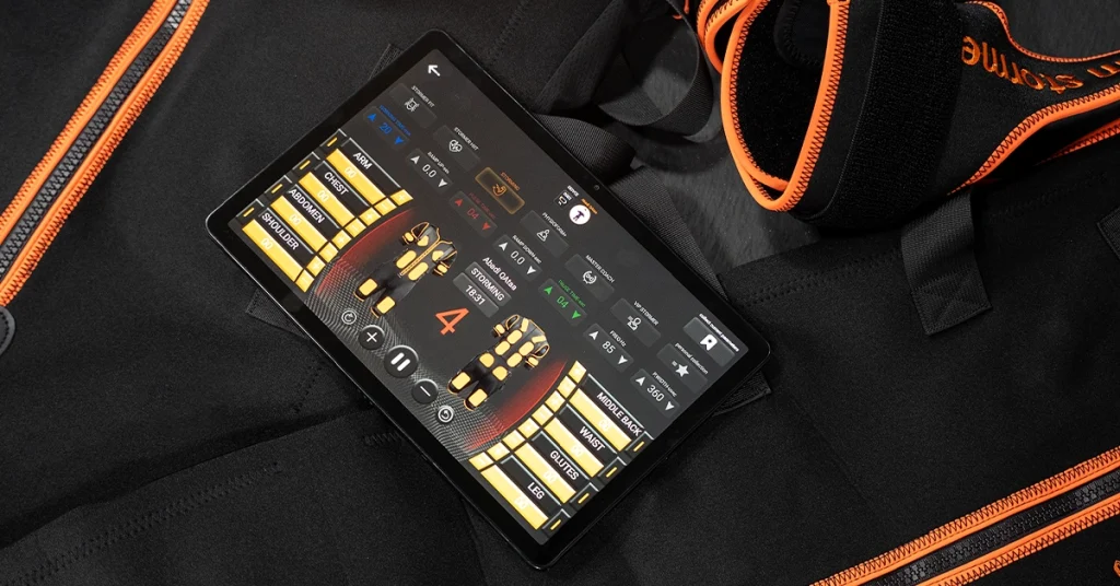 4th Generation Wireless EMS control system displaying real-time muscle stimulation settings and training intensity controls during an EMS workout session at BodyStorm Sport Qatar.